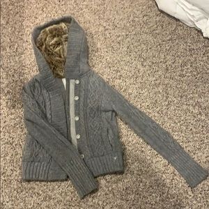 Knit sweater with fur hood